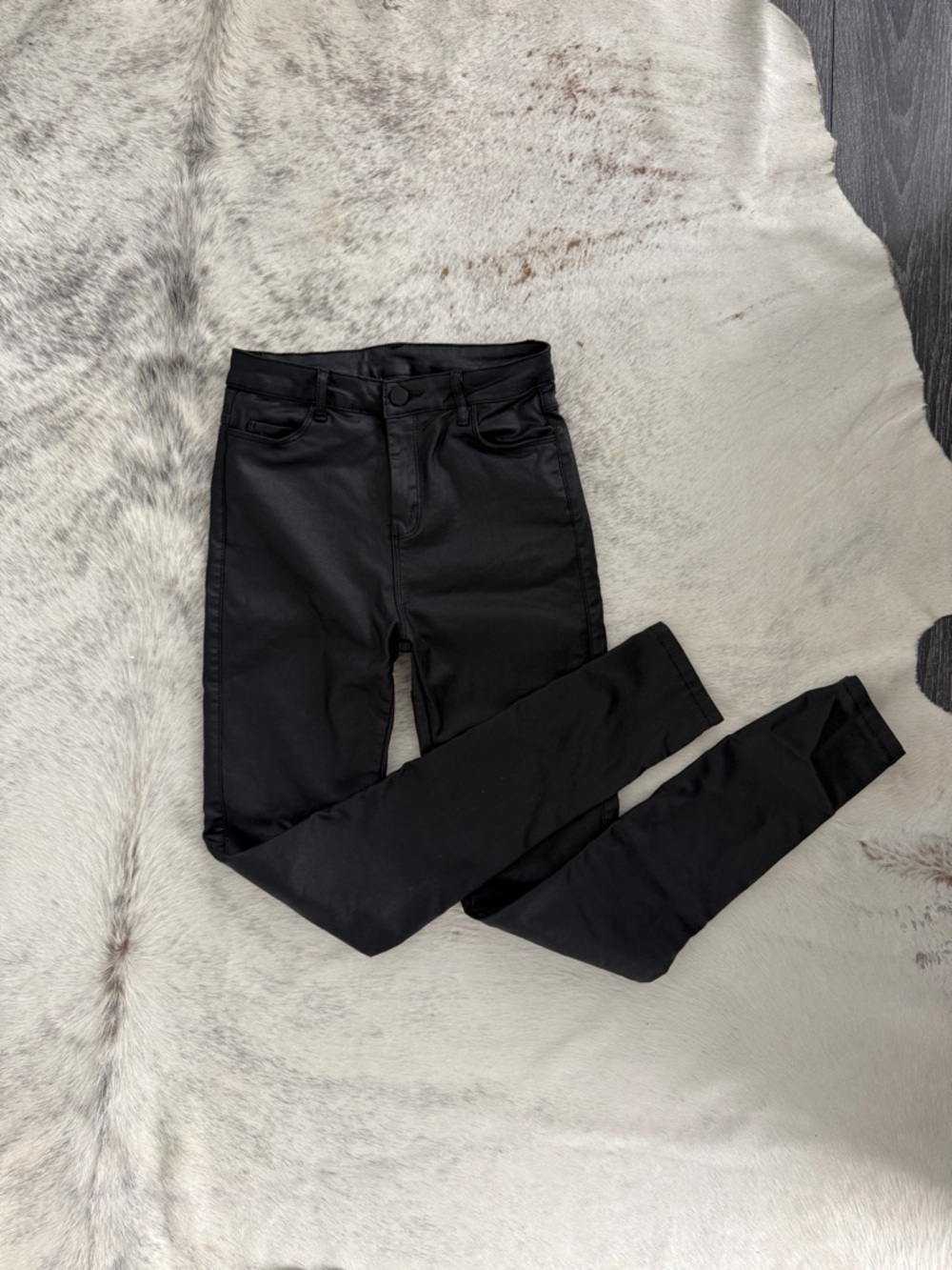 Waxed black skinny jeans